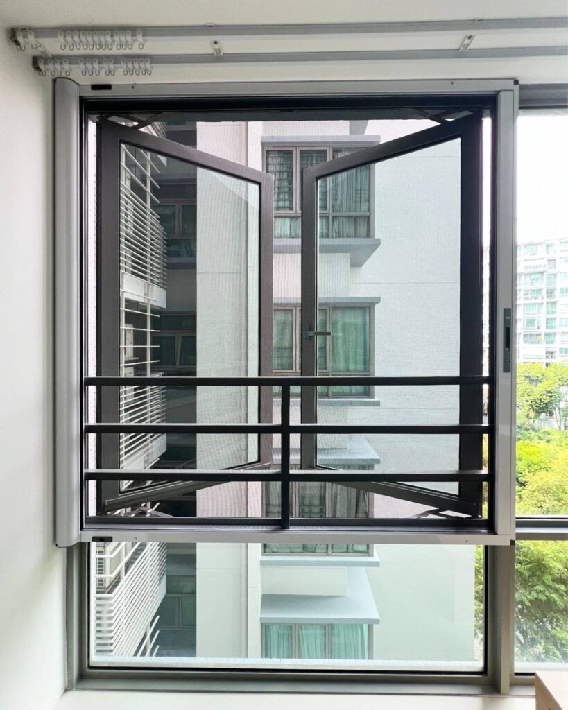 Retractable cat mesh installed on a window grille, keeping cats safe while allowing fresh air