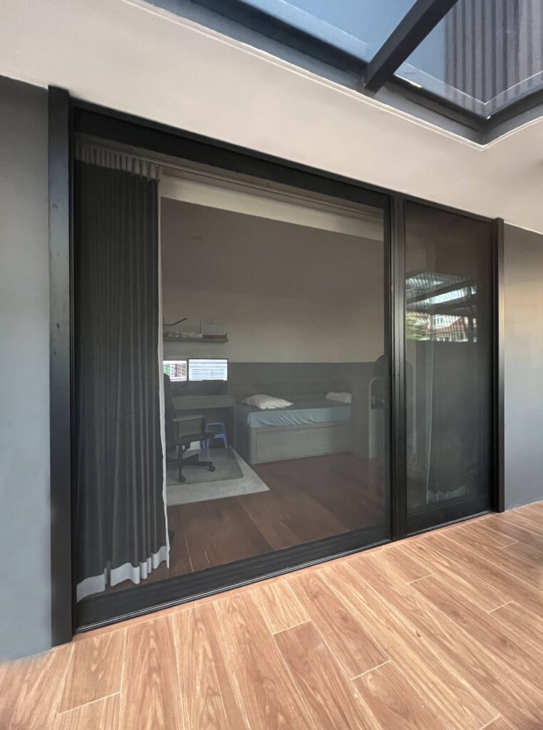 Retractable insect screen for doors installed in Singapore to keep insects out