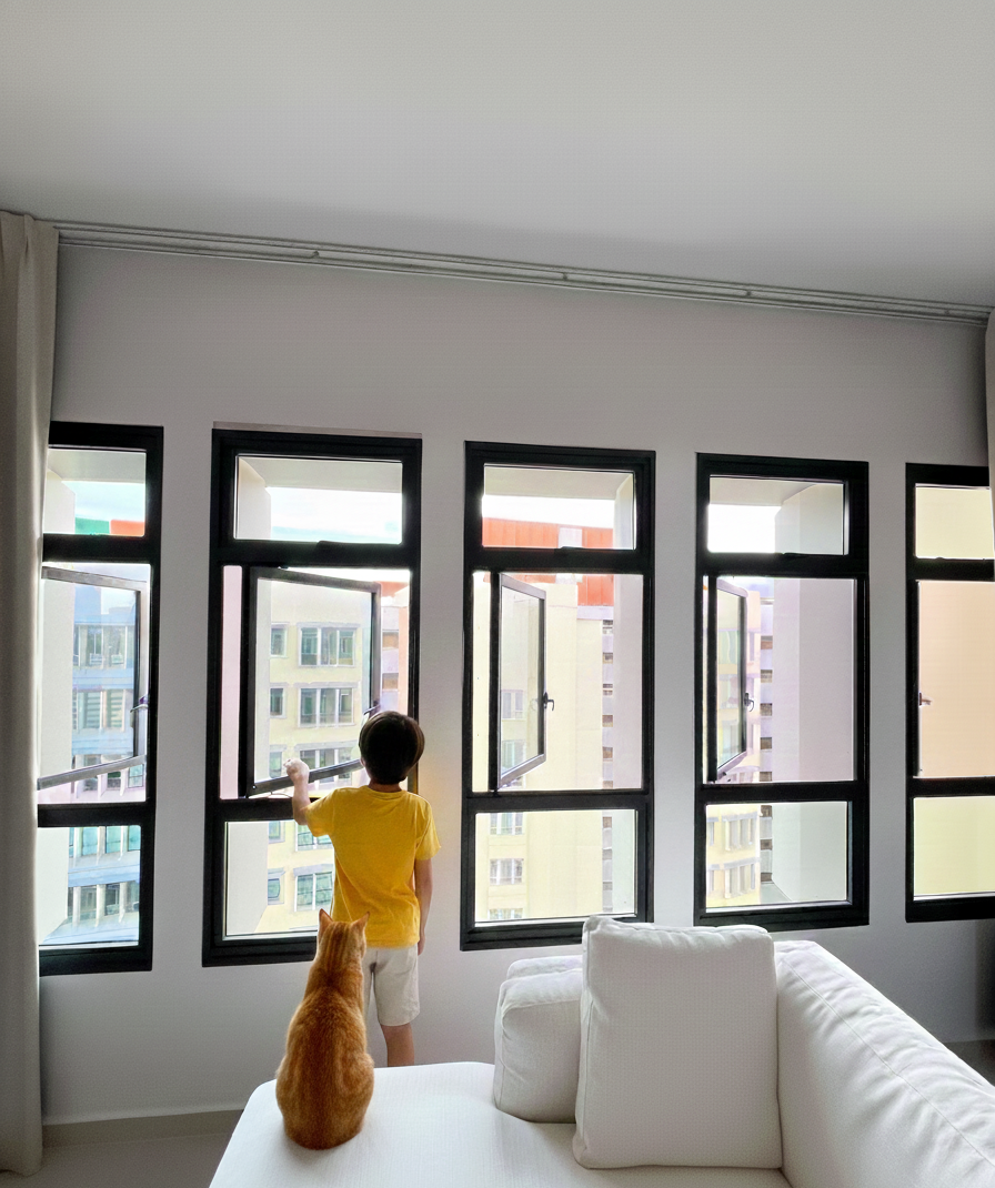 Child and cat near open window fitted with insect mesh and cat mesh window mesh for safety and ventilation.