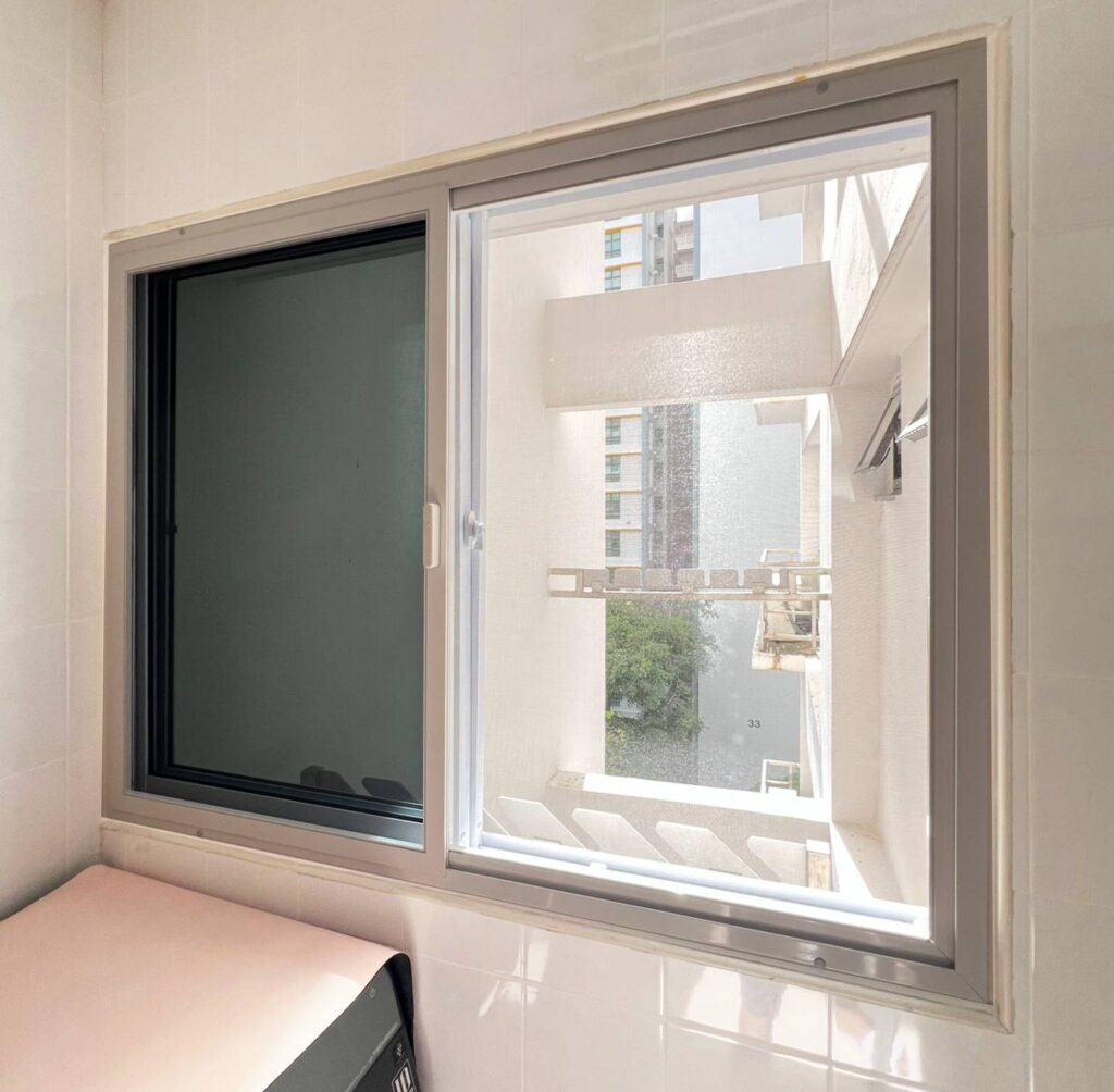 Insect sliding mesh installed on 2 panel sliding windows in modern kitchen for ventilation and insect protection