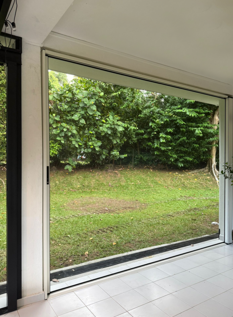 Custom roller mesh system installed in an open space without doors or windows, providing wide-span insect protection and natural airflow for modern outdoor living areas.