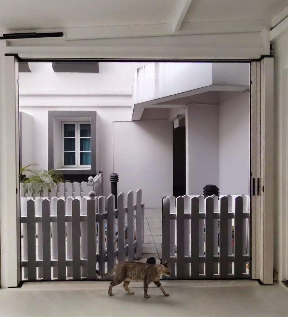 Retractable door mesh installed at the outdoor balcony for cat safety.